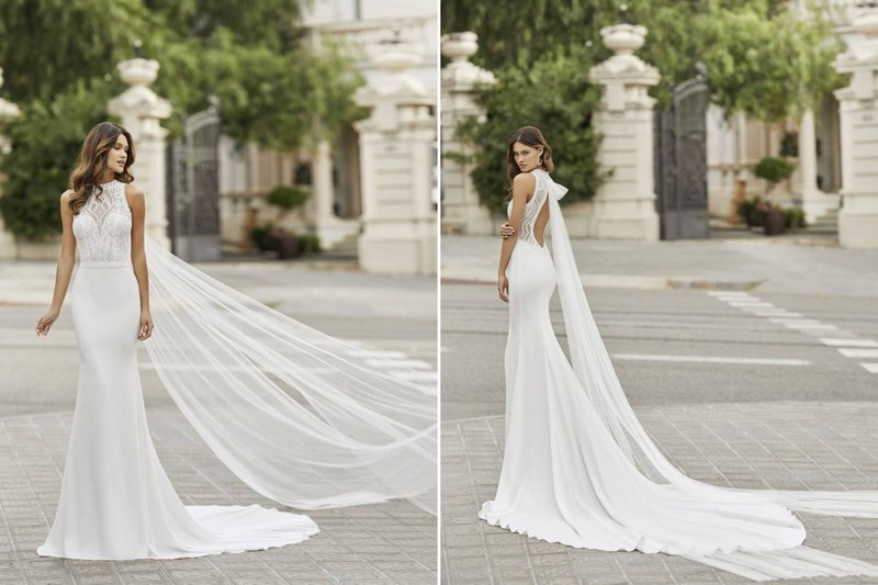 Een%20trouwjurk%20met%20een%20doorschijnende%20cape%20aan%20-%20House%20of%20Weddings